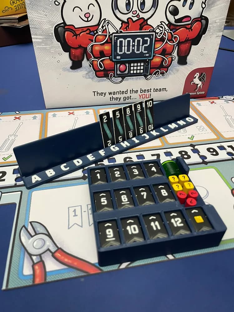 Numbered wire stands and 3D-printed storage trays for Bomb Busters
